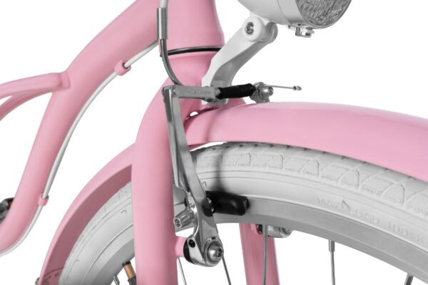 Närbild av rosa cykel med vit däck