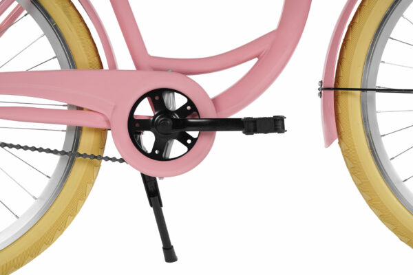 Rosa cykel med gula däck närbild.