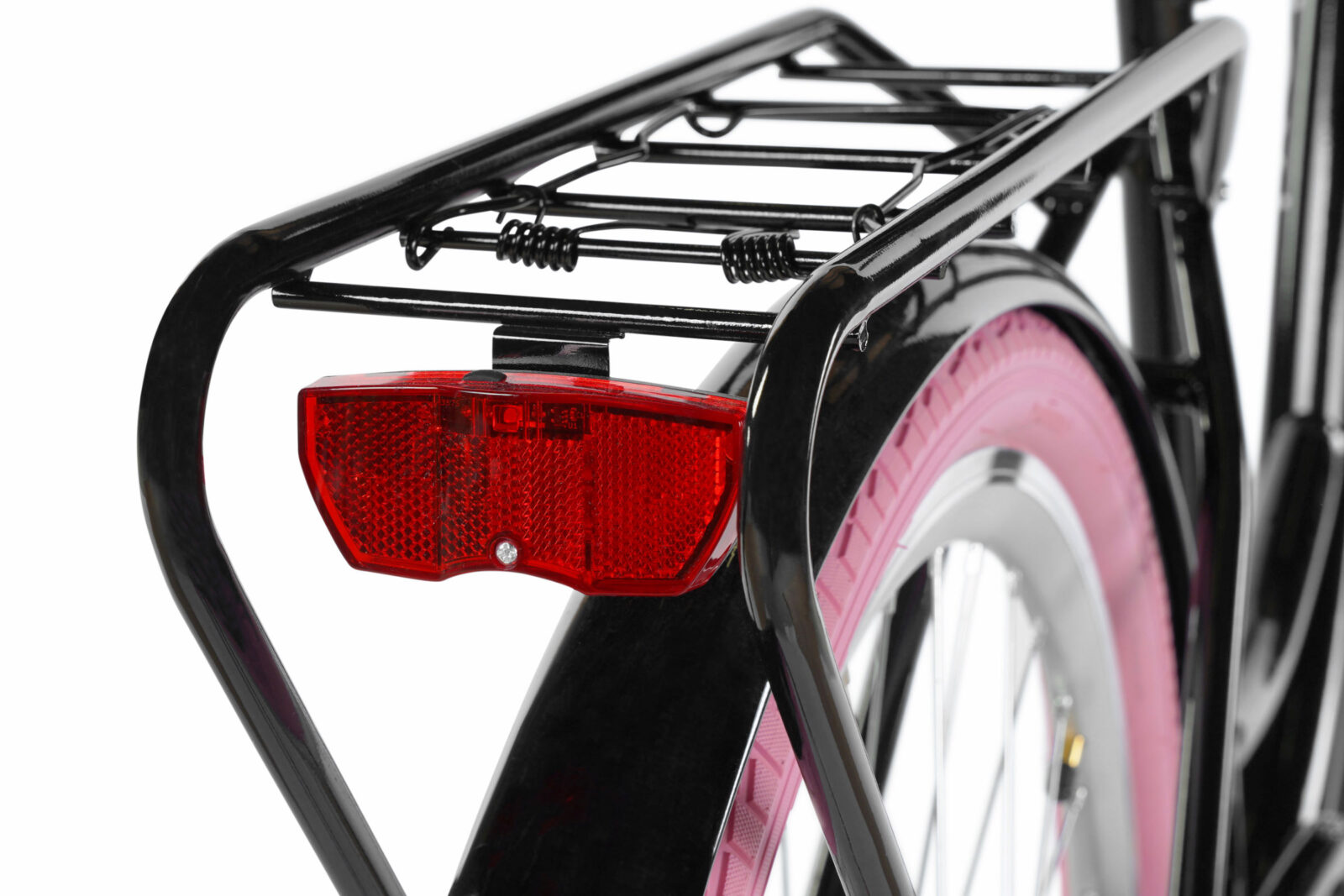 Bakre cykelreflektor och rosa däck i fokus.