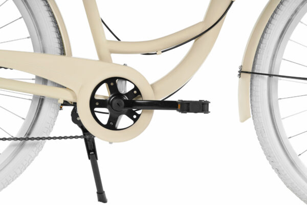 Cykel med beige ram och svarta pedaler